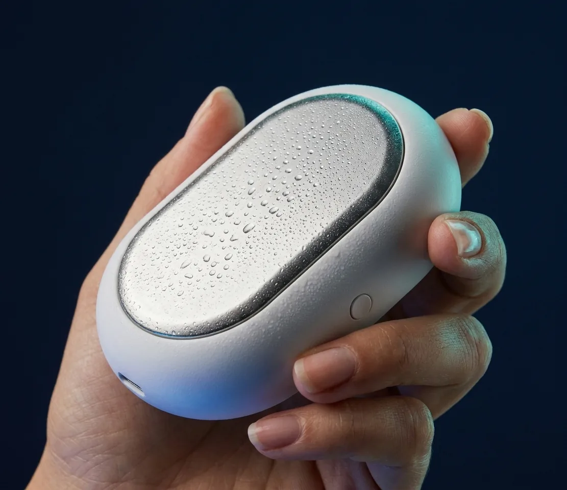 The cooler held in one hand, showing its scale